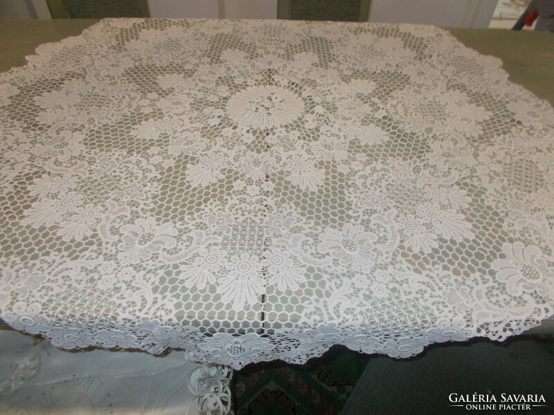 Beautiful snow-white round Brussels lace tablecloth