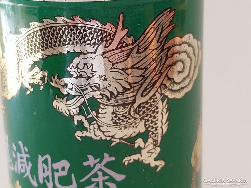 Old metal box with an oriental pattern tea box with a dragon