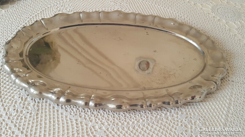 Old metal tray with blistered edge, marked oval