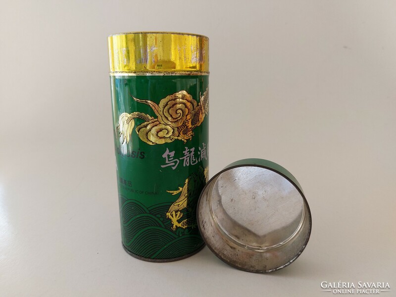 Old metal box with an oriental pattern tea box with a dragon