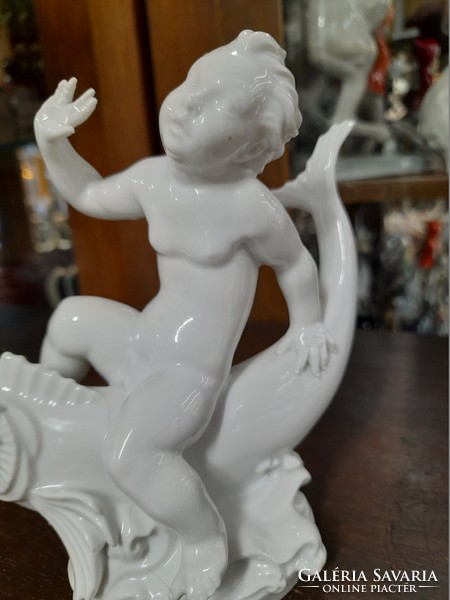 German, Germany Rosenthal putto sitting on a fish, child figural sculpture, porcelain figure. G. Opel. 14.5 Cm.