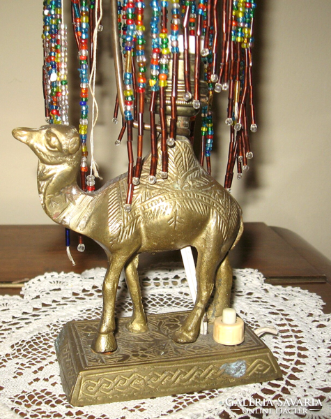 Old brass Turkish lamp on a camel base