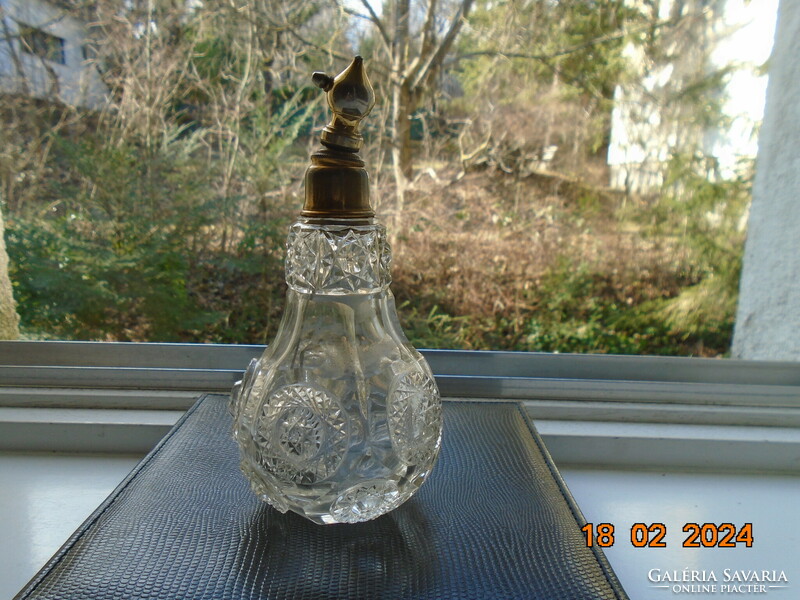 Antique faceted parfum glass with raised raised rosettes and gilded fittings