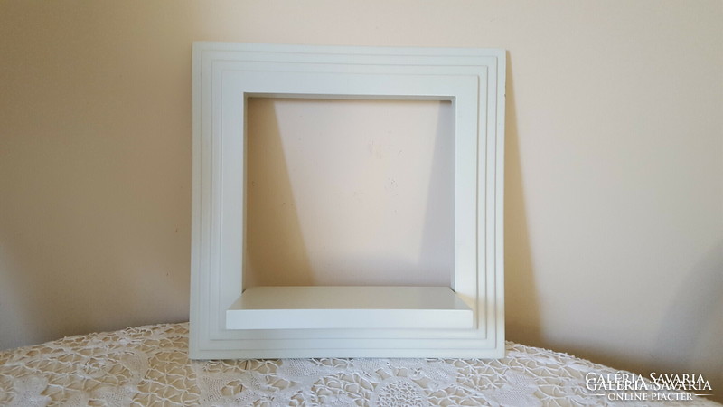 Fold-out shelf with white frame, picture frame 35x35cm.