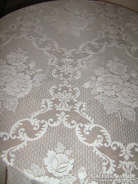 Beautiful baroque curtain with a rich pattern of roses