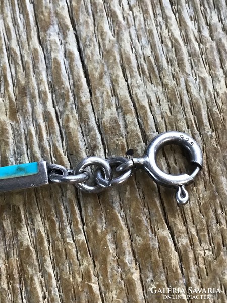 Old silver bracelet with turquoise stones
