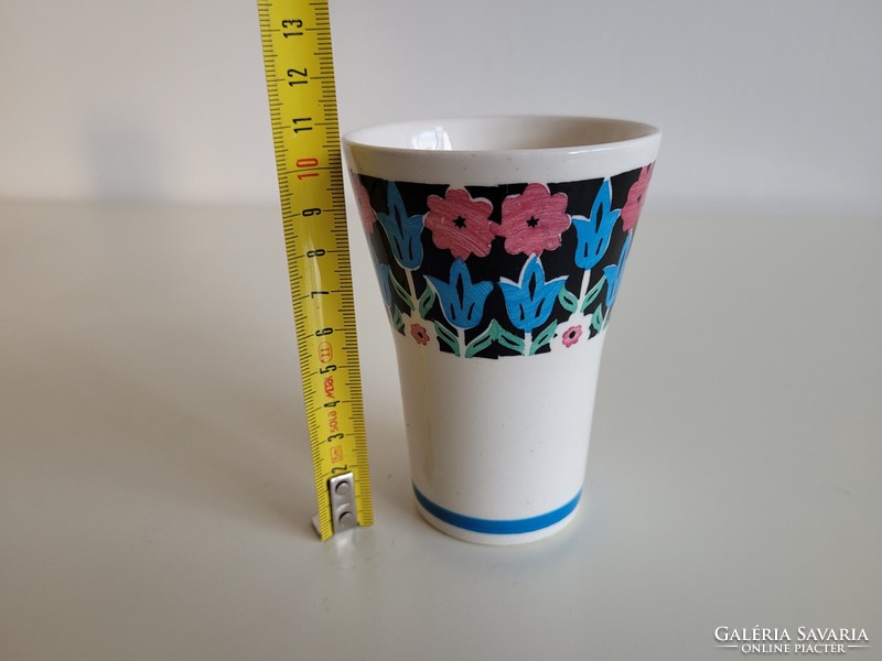 Old granite cup with a tulip pattern