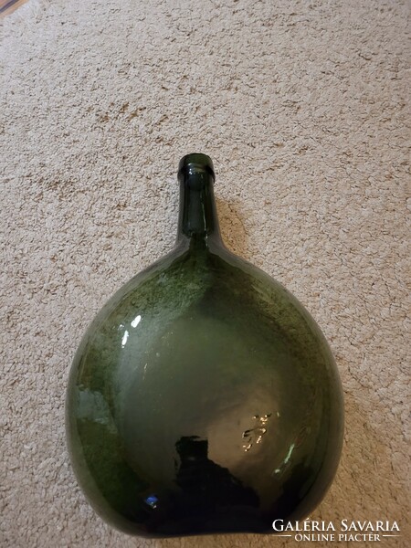 Old giant green glass, bottle.
