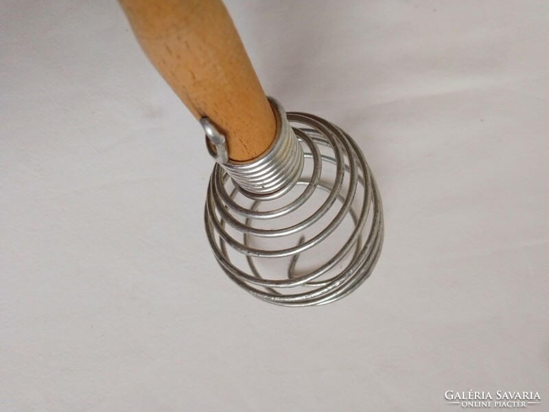 Old wooden handle spring whisk, nostalgia kitchen tool, decoration
