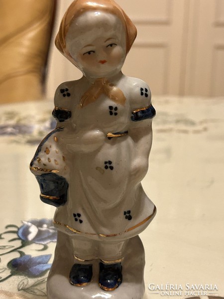 Porcelain girl in a blue dress
