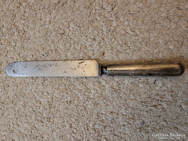 Old butter knife, butter knife with markings.