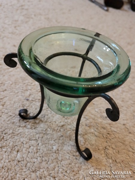 Old glass candle holder with wrought iron holder.