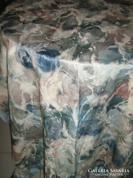 Beautiful floral pattern on light blue parchment curtain