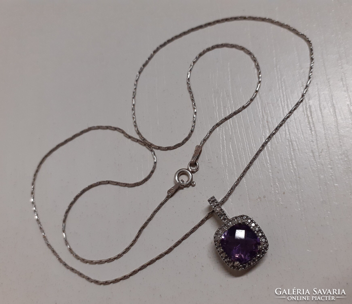 Marked silver necklace with a sparkling amethyst in a silver setting and a pendant with many zirconia stones