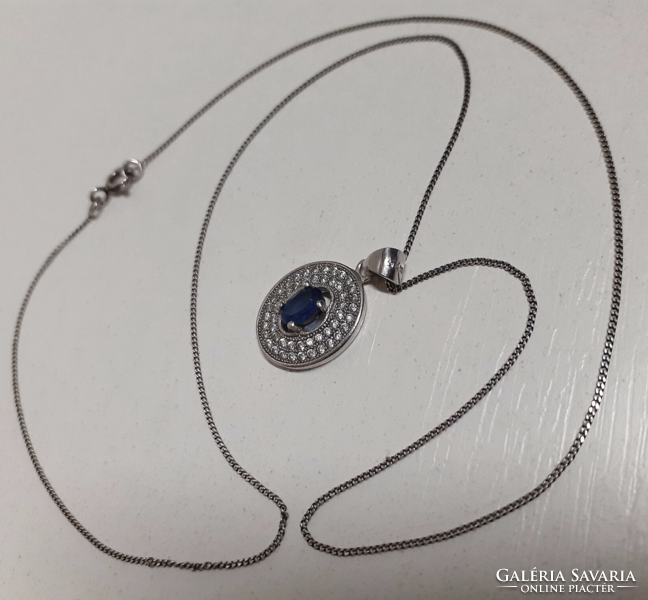 Marked silver necklace with a silver filled sapphire blue circle pendant studded with white zirconia stones