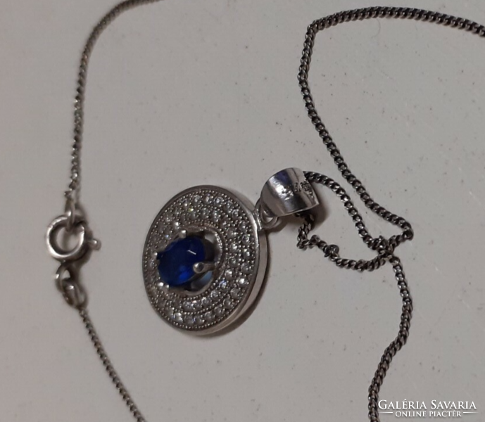 Marked silver necklace with a silver filled sapphire blue circle pendant studded with white zirconia stones