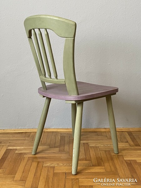 Stable wooden chair painted green and purple