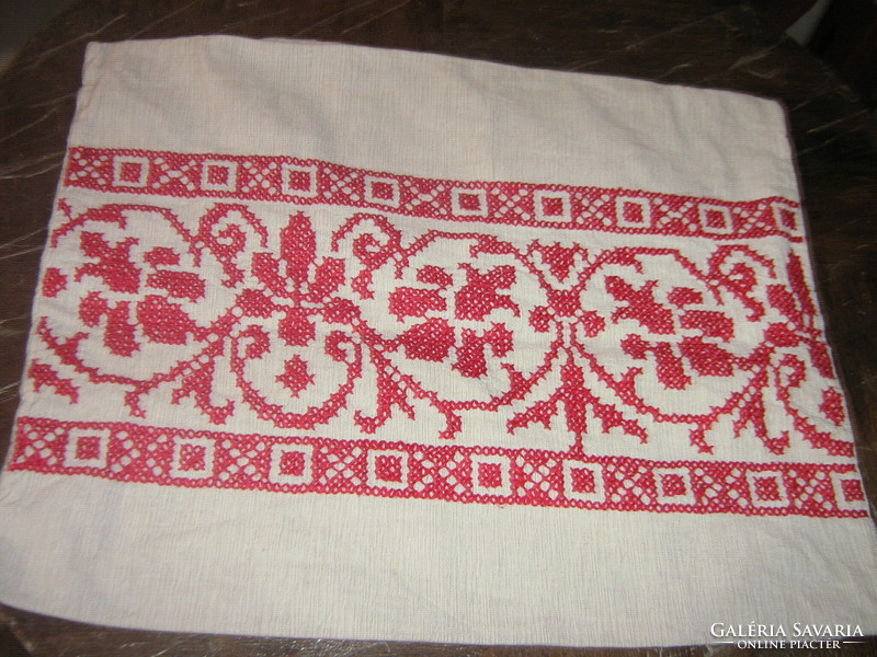 Folk woven decorative pillow made with beautiful cross-stitch embroidery