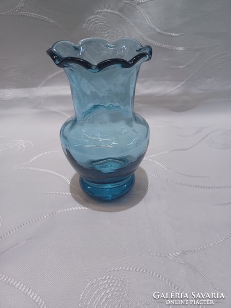Blue glass vase with ruffled edges