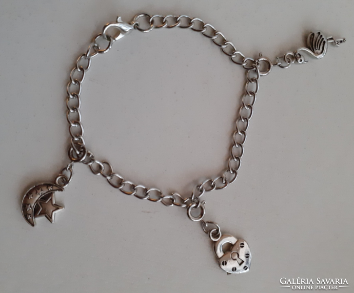 A beautiful silver-colored stainless steel bracelet with small pendants that can be hung