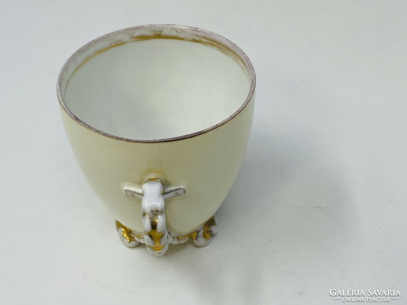 Antique porcelain cup with an unknown man's port, twisted handle and base, gilded decoration rz