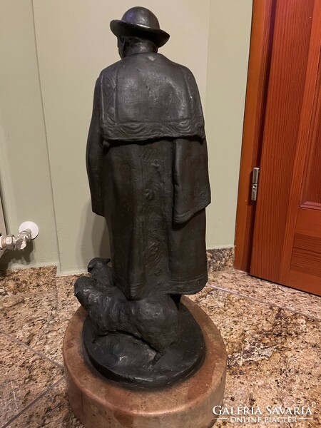 Great talkative John: shepherd with flock bronze statue