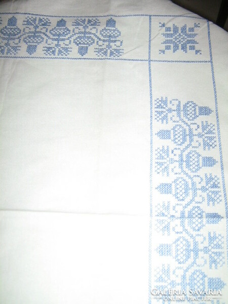 Beautiful acorn tablecloth embroidered with blue cross stitches
