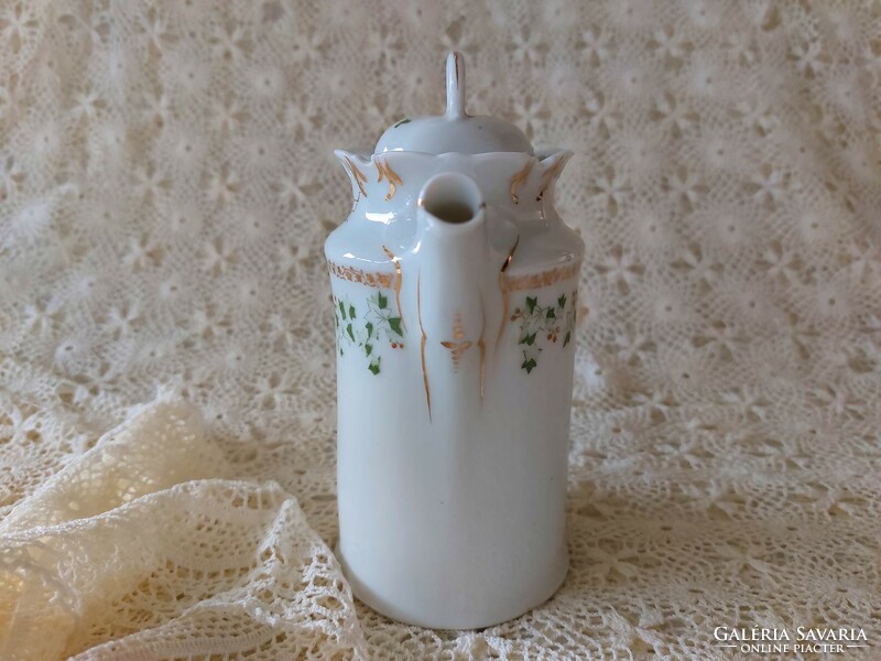 Old porcelain small jug with leaf pattern spout