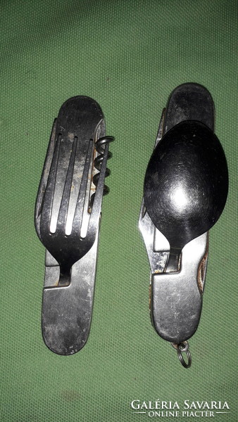 Two Swiss multi-functional steel knives as shown in the pictures