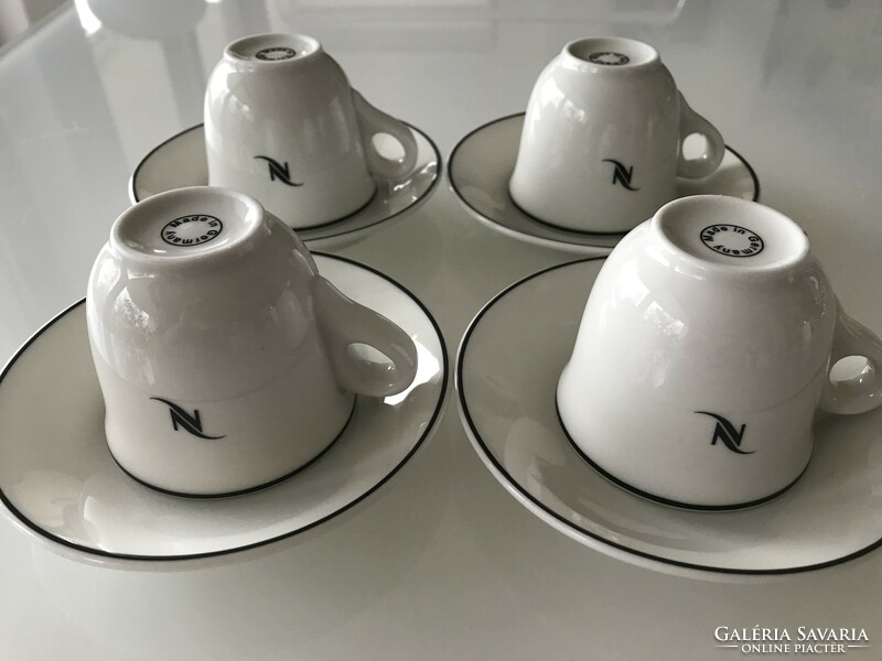 Nespresso cups made of white porcelain with a black border