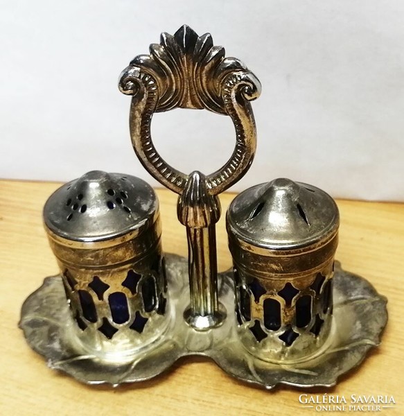 Antique silverware rarity. Tabletop silver-plated salt and pepper shaker with a pair of holders