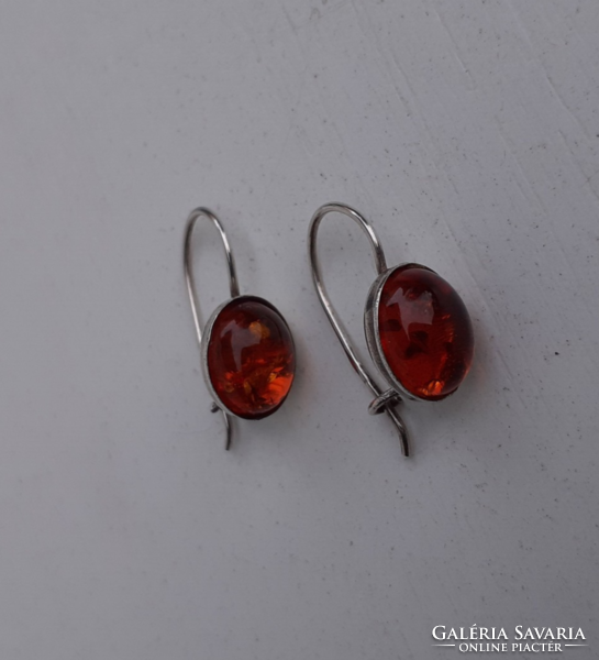 In good condition marked sterling silver hook earrings studded with real amber stones