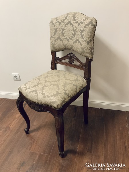 Carved chair with new upholstery