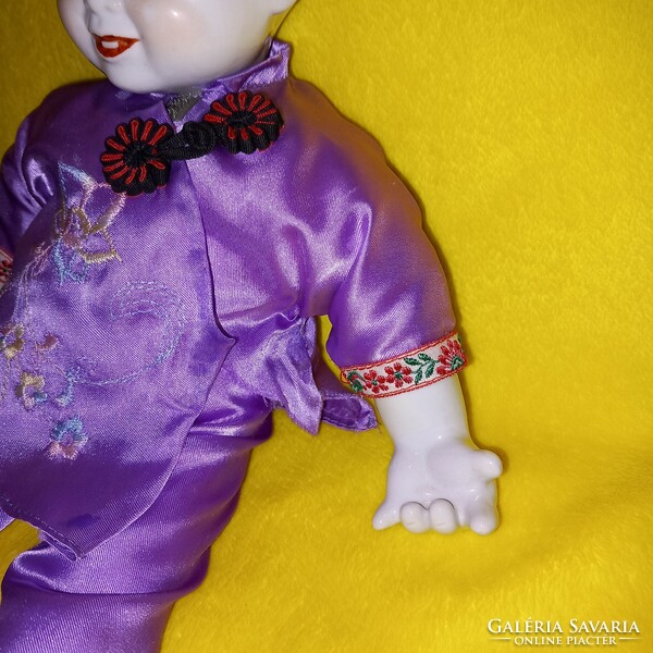 Beautiful, smiling, Chinese porcelain doll. Vintage doll.