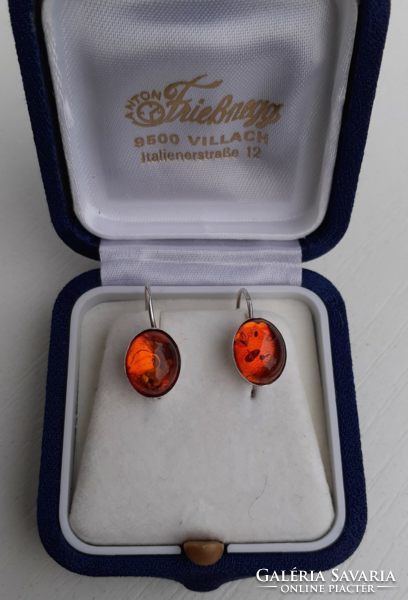 In good condition marked sterling silver hook earrings studded with real amber stones