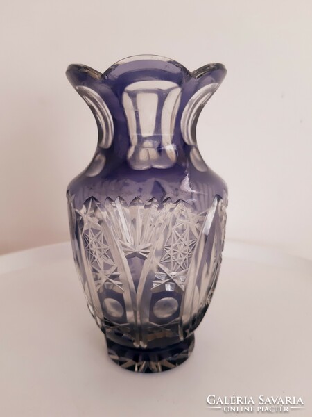 A polished purple crystal vase for her lips