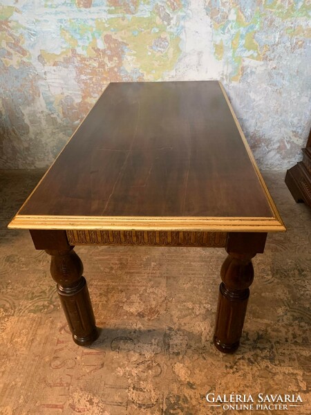 Indian carved table with gold smoke border