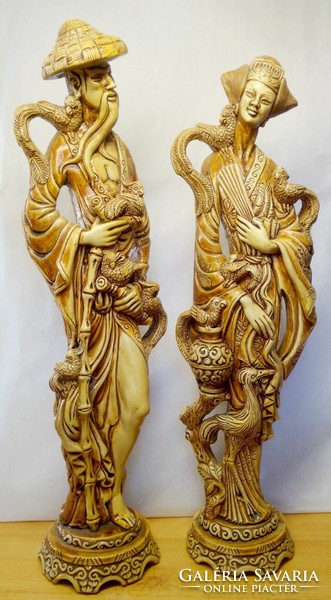 Pair of ethnographic statues. Japanese, Chinese geisha and bodyguard with a couple of phoenixes. Glazed burnt plaster