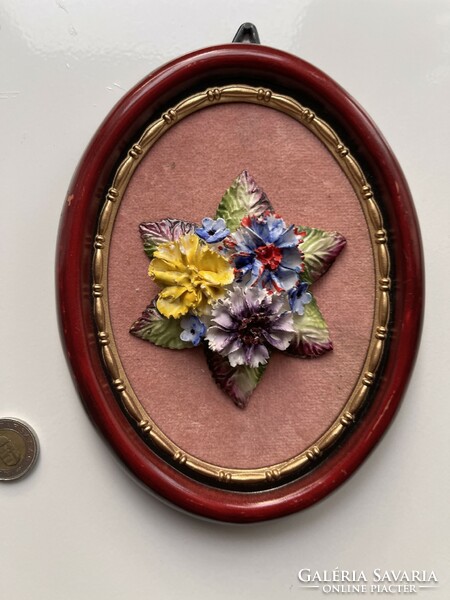 Fairy Italian porcelain flowers on a velvet base in an oval frame.