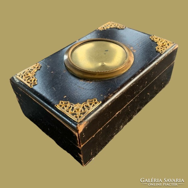 Antique wooden box with copper hammer