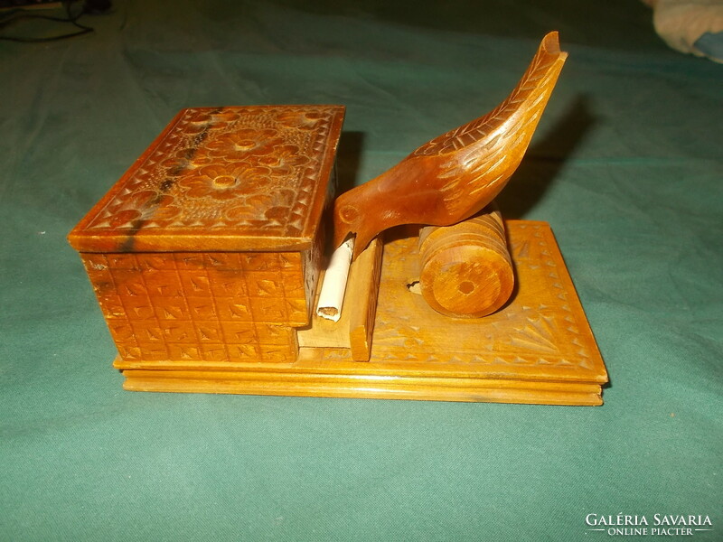 Old carved wooden cigarette holder with birds