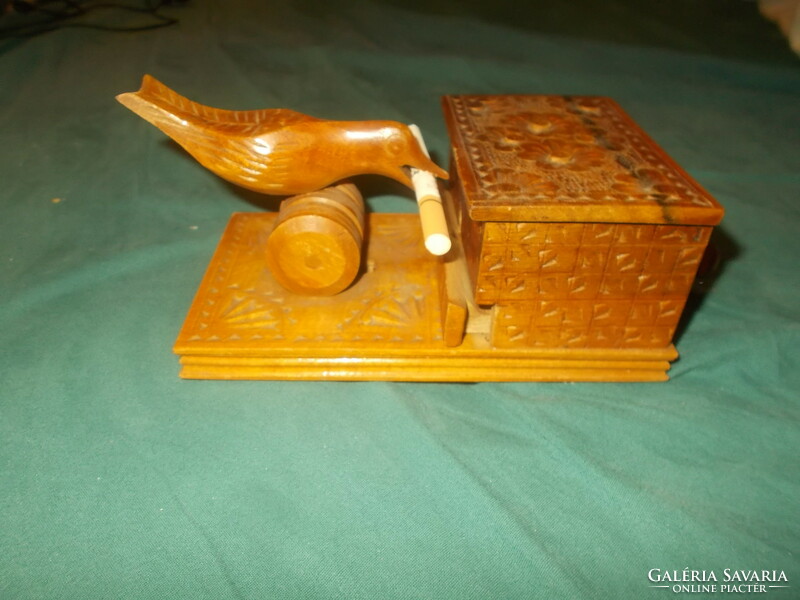 Old carved wooden cigarette holder with birds