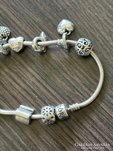 Silver pandora bracelet with many charms