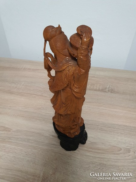 Oriental carved statue depicting a Geisha.