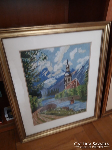 A tapestry picture depicting an Alpine landscape is handmade