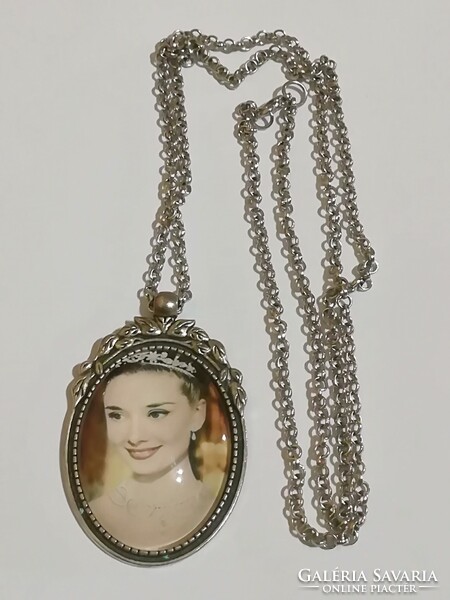 Long necklace with audry hepburn pendant.