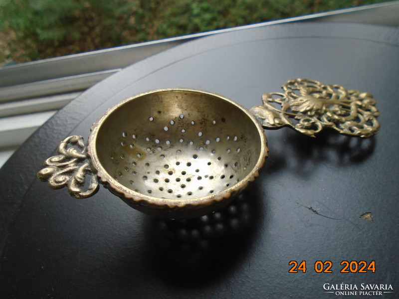 Decorative copper openwork casting with tongs, filter