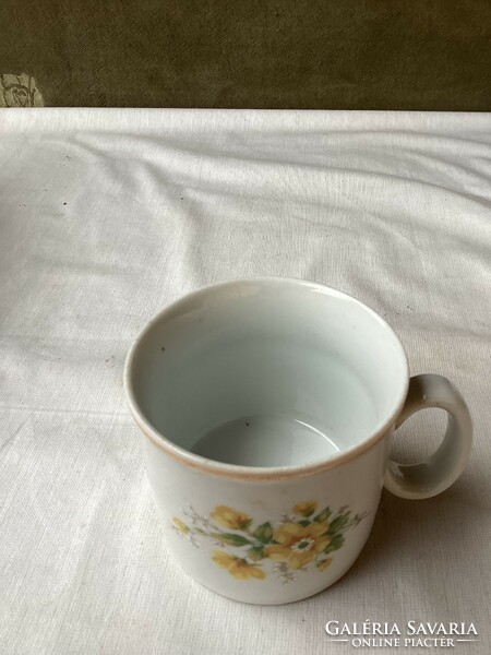 Zsolnay porcelain mug with yellow flowers.