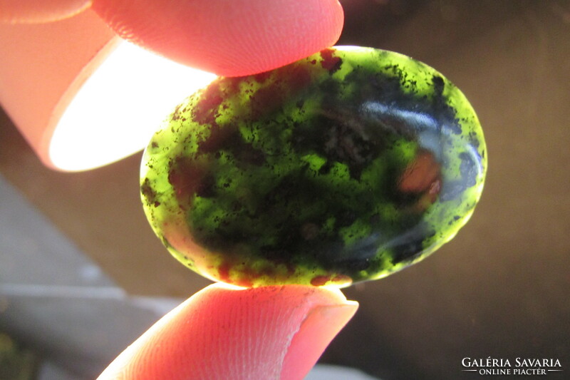 Made with unique craftsmanship, on a gem-quality serpentine cabochon, which is considered world rarity