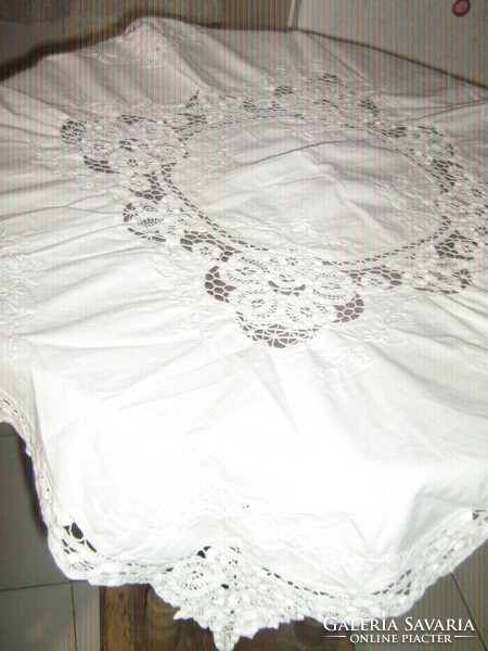 Wonderful ribbon embroidered on special snow-white lace tablecloth